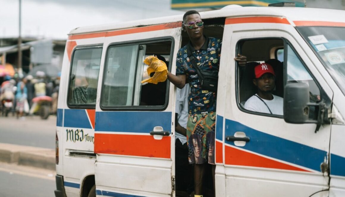 Yound man on a taxi bus in the city