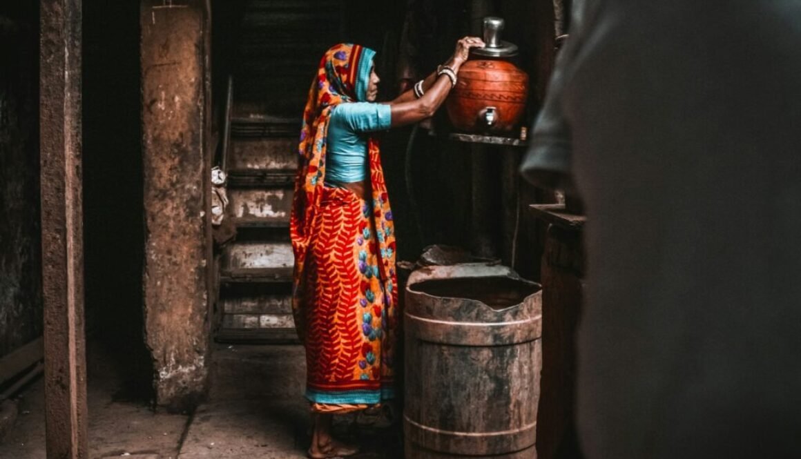 An Indian woman pouring water